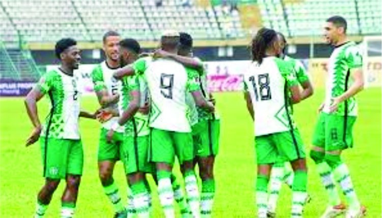 Nigeria’s Super Eagles console themselves after losing to Tunisia at the 2021 AFCON.